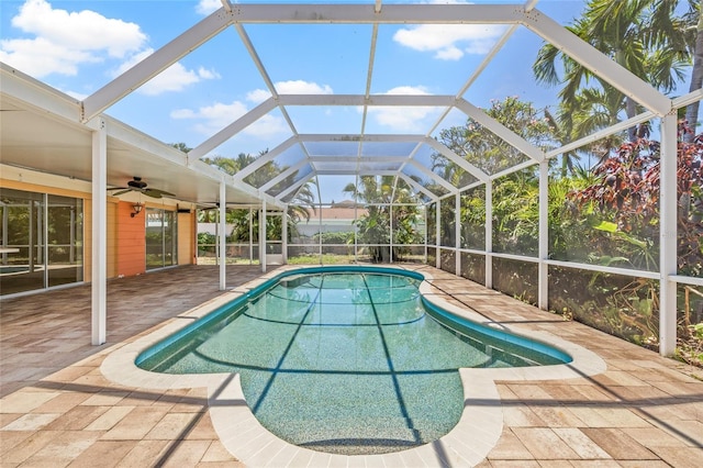 1141 80th Street Ct S, Saint Petersburg, FL 33707 - swimming pool with ceiling fan, a patio area, and a lanai