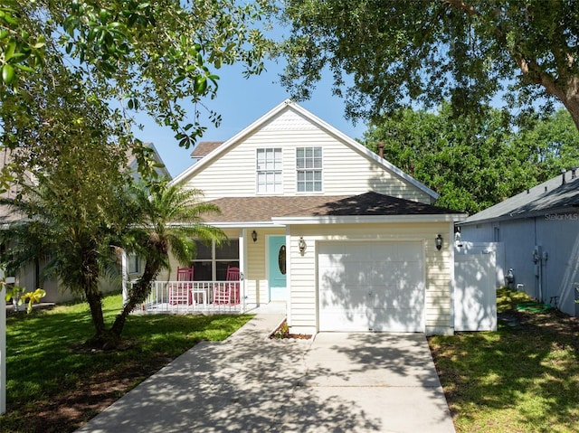 5607 Tanagergrove Way, Lithia, FL 33547 - traditional-style house featuring a garage, a front lawn, a shingled roof, concrete driveway, and a porch