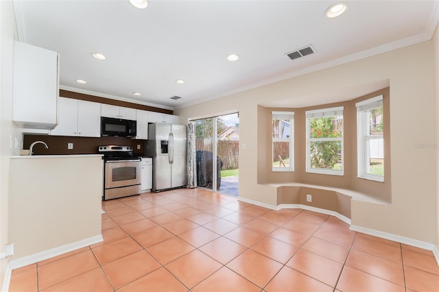 5607 Tanagergrove Way, Lithia, FL 33547 - kitchen featuring visible vents, appliances with stainless steel finishes, ornamental molding, recessed lighting, and white cabinetry