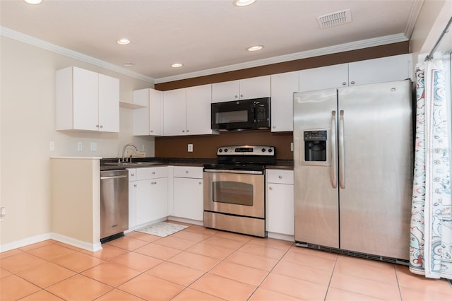 5607 Tanagergrove Way, Lithia, FL 33547 - kitchen featuring visible vents, ornamental molding, white cabinetry, a sink, and stainless steel appliances