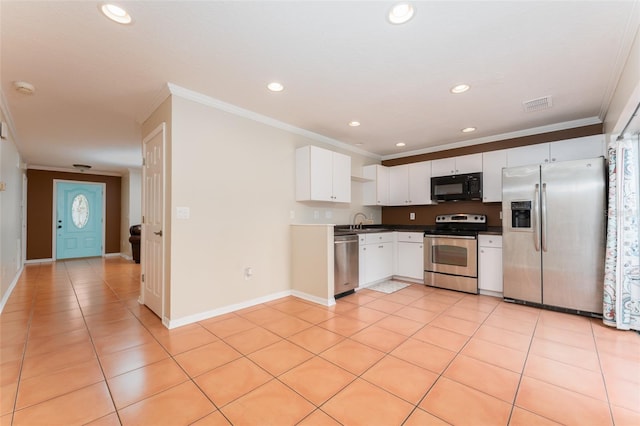 5607 Tanagergrove Way, Lithia, FL 33547 - kitchen with appliances with stainless steel finishes, a sink, light tile patterned floors, visible vents, and ornamental molding