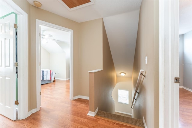 5607 Tanagergrove Way, Lithia, FL 33547 - hallway with baseboards, light wood finished floors, and an upstairs landing