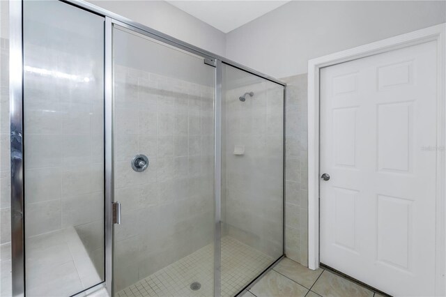 10506 Sky Flower Ct, Land O Lakes, FL 34638 - full bathroom featuring tile patterned floors and a shower stall