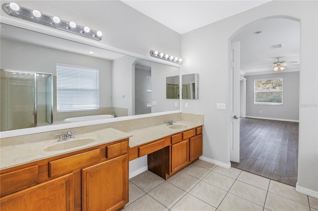 10506 Sky Flower Ct, Land O Lakes, FL 34638 - full bath with visible vents, a sink, tile patterned flooring, and a shower stall
