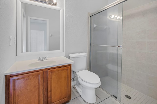 10506 Sky Flower Ct, Land O Lakes, FL 34638 - bathroom with vanity, tile patterned flooring, a shower stall, and toilet