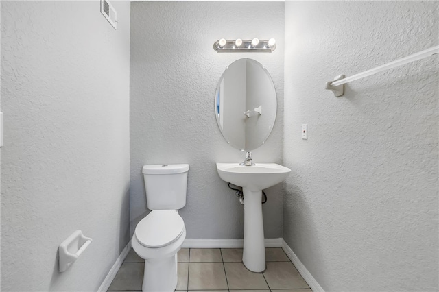 10506 Sky Flower Ct, Land O Lakes, FL 34638 - half bathroom with toilet, visible vents, and tile patterned flooring