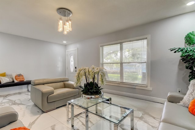 living room with recessed lighting, baseboards, a notable chandelier, and marble finish floor