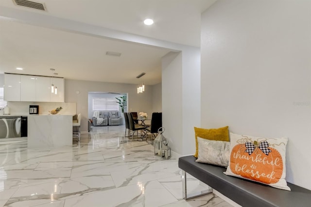 interior space featuring visible vents, recessed lighting, and marble finish floor