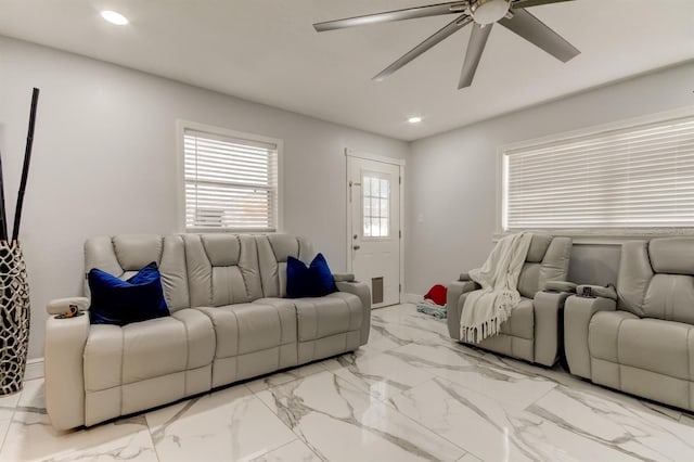 living room featuring recessed lighting, ceiling fan, baseboards, and marble finish floor