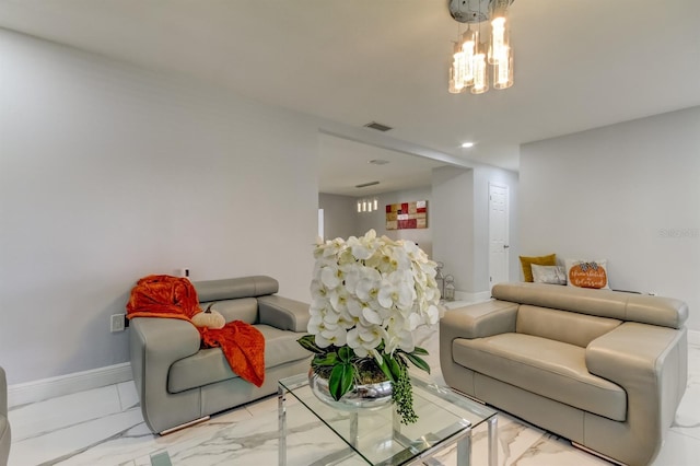 living area with visible vents, marble finish floor, baseboards, and a notable chandelier