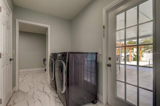 washroom with washer and dryer, laundry area, baseboards, and marble finish floor