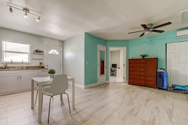 dining area with baseboards, ceiling fan, and a wall unit AC