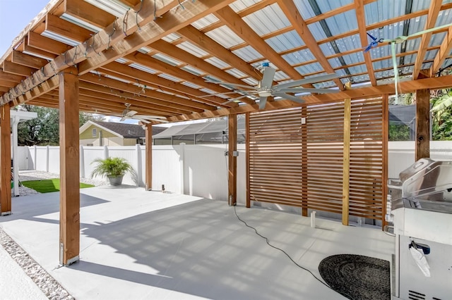 view of patio featuring fence and a ceiling fan