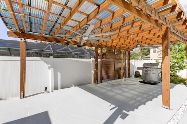 view of patio with area for grilling and fence