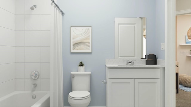 full bath featuring vanity, shower / bath combo, and toilet