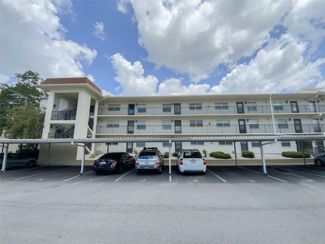 view of property featuring covered parking