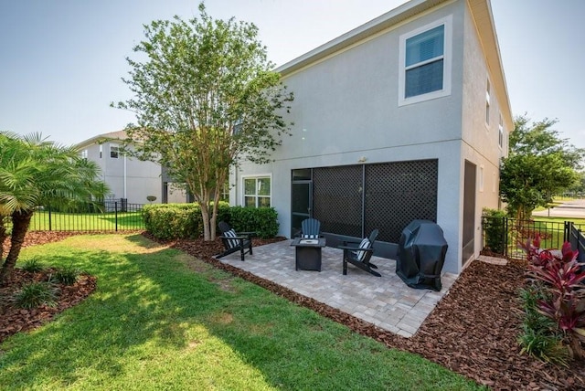 back of house featuring a patio area and stucco siding