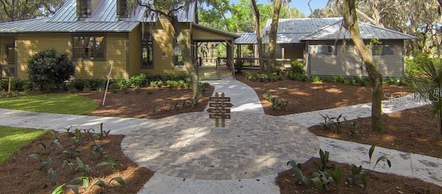 view of front of property with a standing seam roof and metal roof