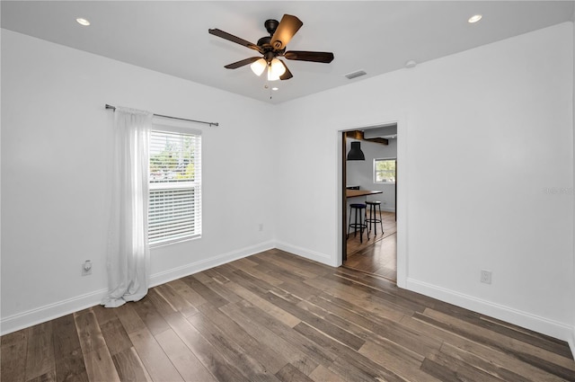 spare room with visible vents, baseboards, dark wood-style floors, recessed lighting, and a ceiling fan