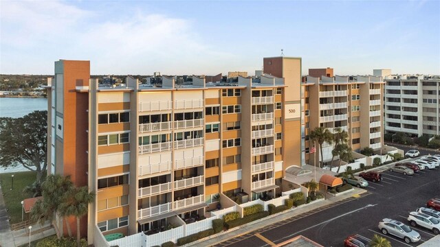 view of property featuring uncovered parking