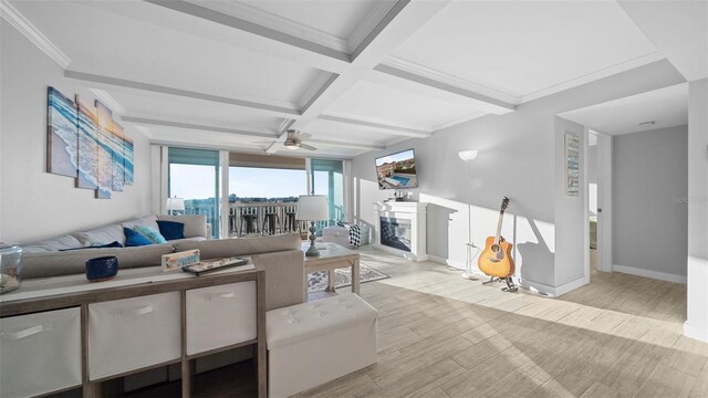 living room with ceiling fan, beamed ceiling, coffered ceiling, and light wood-style flooring