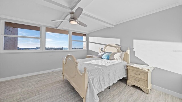 bedroom featuring baseboards, ceiling fan, light wood finished floors, and beam ceiling