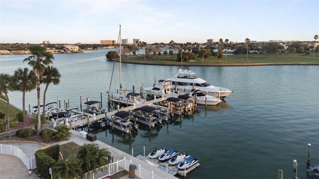 view of water feature with a boat dock and fence
