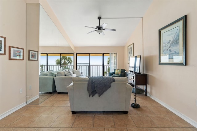 7540 Sunshine Skyway Ln S # 219, Saint Petersburg, FL 33711 - living area with baseboards, a ceiling fan, a wealth of natural light, and high vaulted ceiling