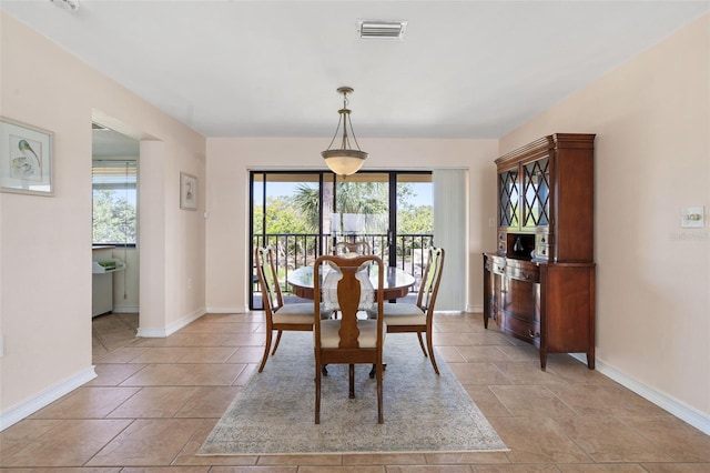 7540 Sunshine Skyway Ln S # 219, Saint Petersburg, FL 33711 - dining space featuring baseboards and visible vents