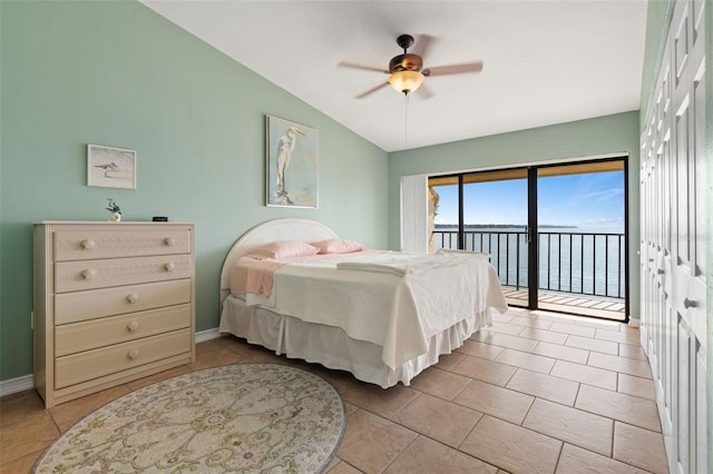 7540 Sunshine Skyway Ln S # 219, Saint Petersburg, FL 33711 - bedroom with access to outside, tile patterned flooring, baseboards, a water view, and vaulted ceiling