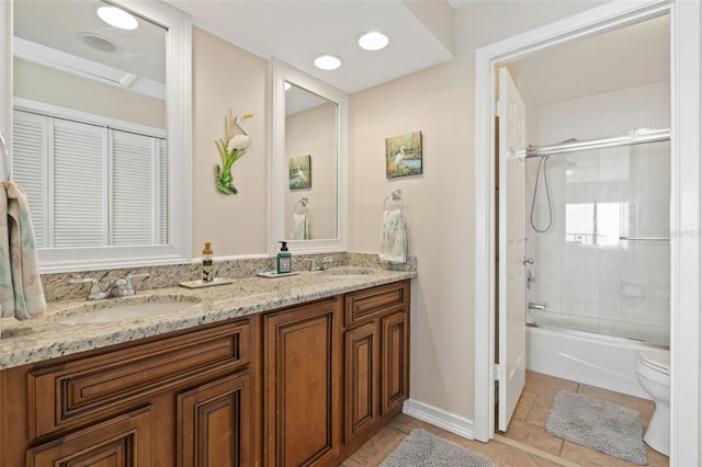 7540 Sunshine Skyway Ln S # 219, Saint Petersburg, FL 33711 - full bathroom featuring a sink, tile patterned flooring, toilet, and double vanity