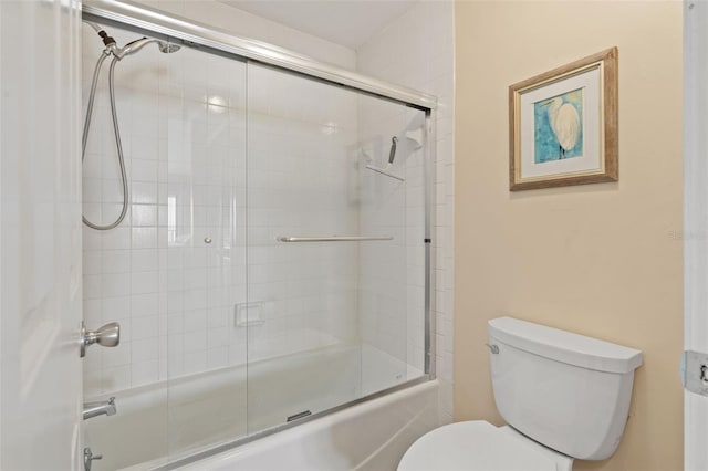 7540 Sunshine Skyway Ln S # 219, Saint Petersburg, FL 33711 - bathroom with combined bath / shower with glass door and toilet