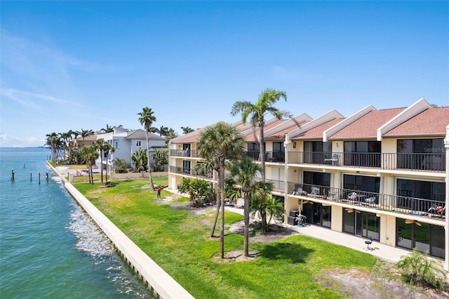 7540 Sunshine Skyway Ln S # 219, Saint Petersburg, FL 33711 - surrounding community featuring a residential view, a water view, and a lawn