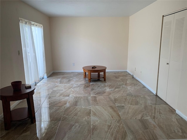 1799 N Highland Ave Unit 170, Clearwater, FL 33755 - empty room featuring light marble finish floors and baseboards