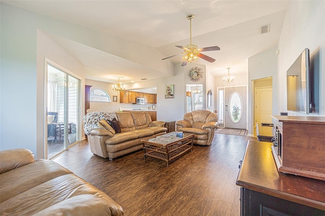 11311 Corey Pavin Ln, San Antonio, FL 33576 - living area featuring a chandelier, dark wood-style flooring, a ceiling fan, and lofted ceiling