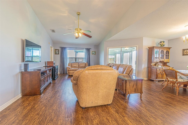 11311 Corey Pavin Ln, San Antonio, FL 33576 - living area featuring lofted ceiling, a ceiling fan, dark wood-style flooring, and a chandelier