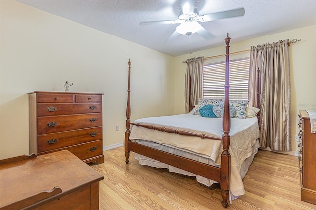 11311 Corey Pavin Ln, San Antonio, FL 33576 - bedroom with light wood-type flooring and a ceiling fan