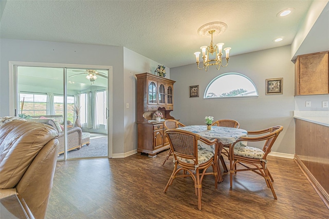 11311 Corey Pavin Ln, San Antonio, FL 33576 - dining space with dark wood-style floors, plenty of natural light, a chandelier, a textured ceiling, and recessed lighting