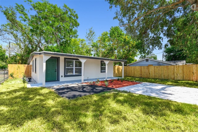 10011 N Annette Ave, Tampa, FL 33612 - ranch-style house featuring stucco siding, a fenced backyard, and covered porch