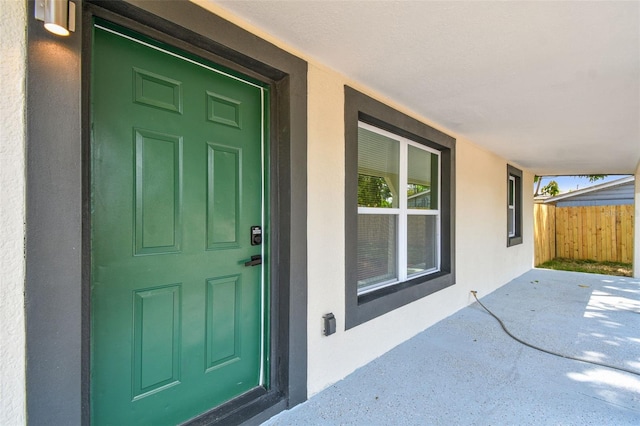 10011 N Annette Ave, Tampa, FL 33612 - doorway to property with stucco siding