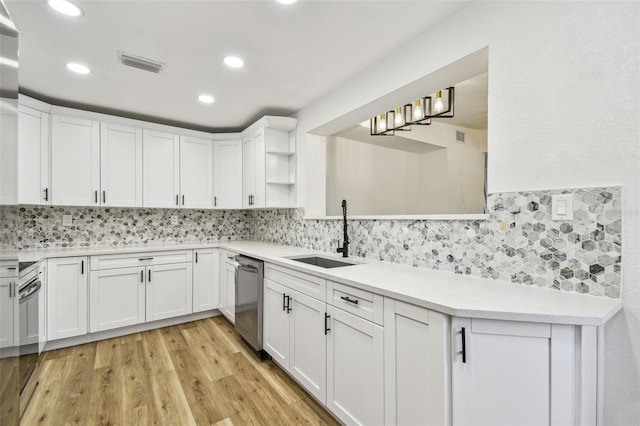 10011 N Annette Ave, Tampa, FL 33612 - kitchen featuring dishwasher, decorative backsplash, white cabinets, light countertops, and recessed lighting