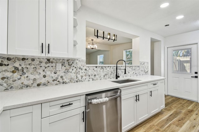 10011 N Annette Ave, Tampa, FL 33612 - kitchen featuring dishwasher, light wood-style flooring, recessed lighting, light countertops, and white cabinets
