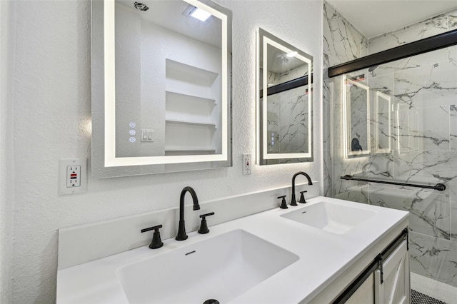 10011 N Annette Ave, Tampa, FL 33612 - full bathroom with a textured wall, double vanity, and a marble finish shower