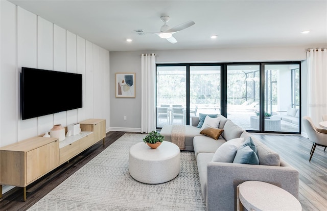 5953 Bluestar Ct, Lakewood Ranch, FL 34211 - living room featuring visible vents, a ceiling fan, dark wood finished floors, and baseboards