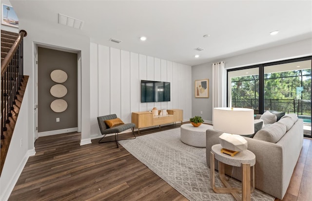 5953 Bluestar Ct, Lakewood Ranch, FL 34211 - living area featuring stairs, baseboards, visible vents, and dark wood finished floors