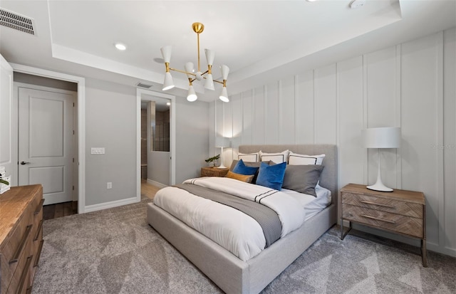 5953 Bluestar Ct, Lakewood Ranch, FL 34211 - bedroom featuring visible vents, carpet floors, a notable chandelier, and a tray ceiling