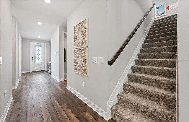 5953 Bluestar Ct, Lakewood Ranch, FL 34211 - entrance foyer with recessed lighting, baseboards, stairs, and dark wood-type flooring