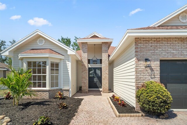 4317 74th Ave E, Sarasota, FL 34243 - entrance to property with brick siding and an attached garage