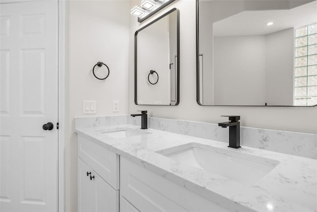 4317 74th Ave E, Sarasota, FL 34243 - bathroom featuring double vanity, recessed lighting, and a sink