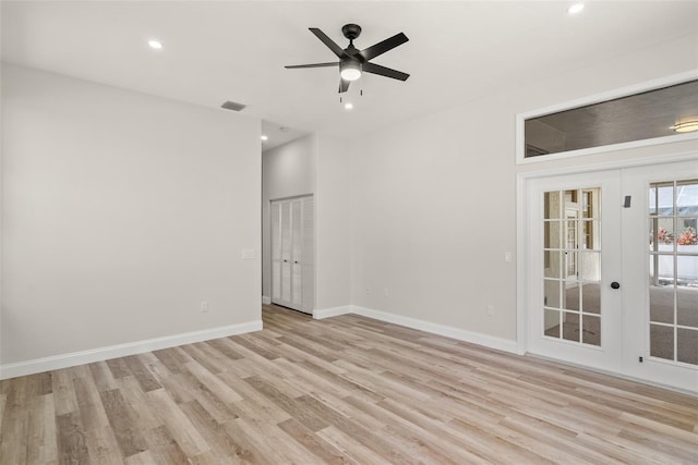 4317 74th Ave E, Sarasota, FL 34243 - empty room featuring french doors, light wood-type flooring, and visible vents